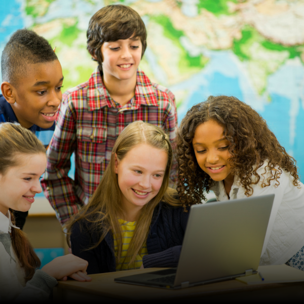 kids looking at a computer smiling